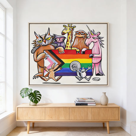 a vibrant and colorful painting of a group of animals, including a cat, giraffe, unicorn, and rabbit, all holding a rainbow flag. The painting is displayed on a white wall above a wooden cabinet, which has a plant and some books on it.